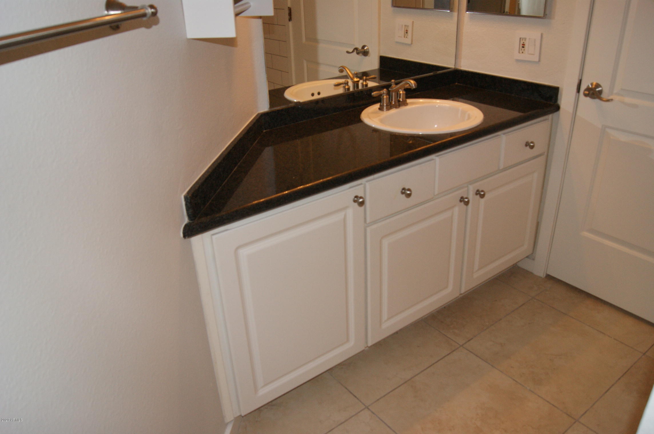 3633 North 3rd Avenue, Unit 1060 Phoenix, AZ 85013 - Photo 19 of 23 a bathroom with a sink and a mirror