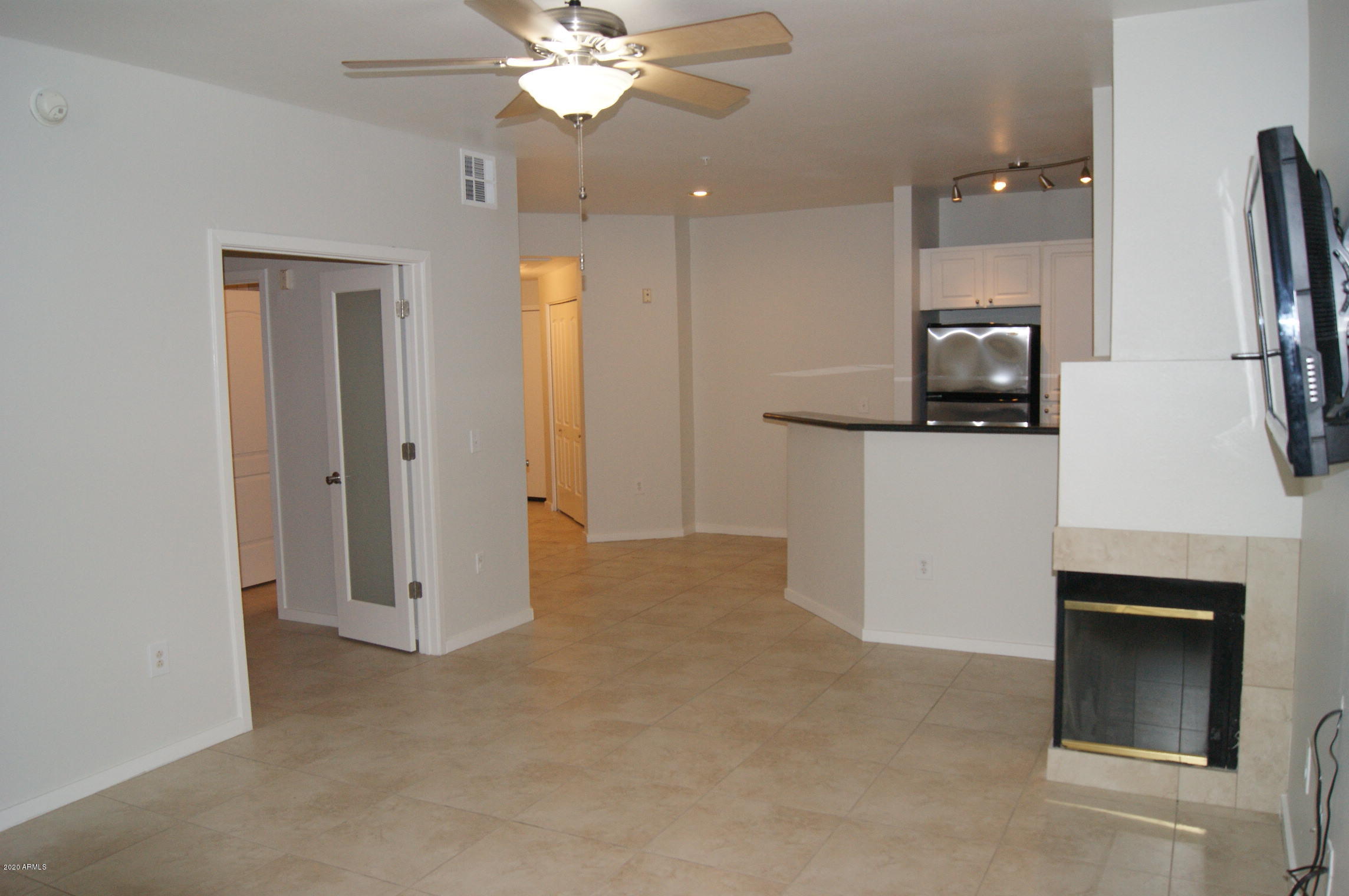 3633 North 3rd Avenue, Unit 1060 Phoenix, AZ 85013 - Photo 7 of 23 a view of a kitchen with a sink and a refrigerator