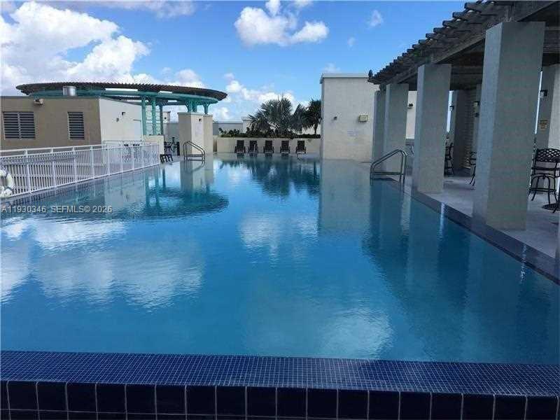 7275 Southwest 90th Way, Unit G 611 Miami, FL 33156 - Photo 22 of 56 a view of a terrace with seating area