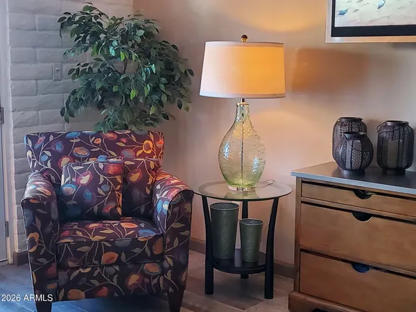 a room with furniture and a potted plant
