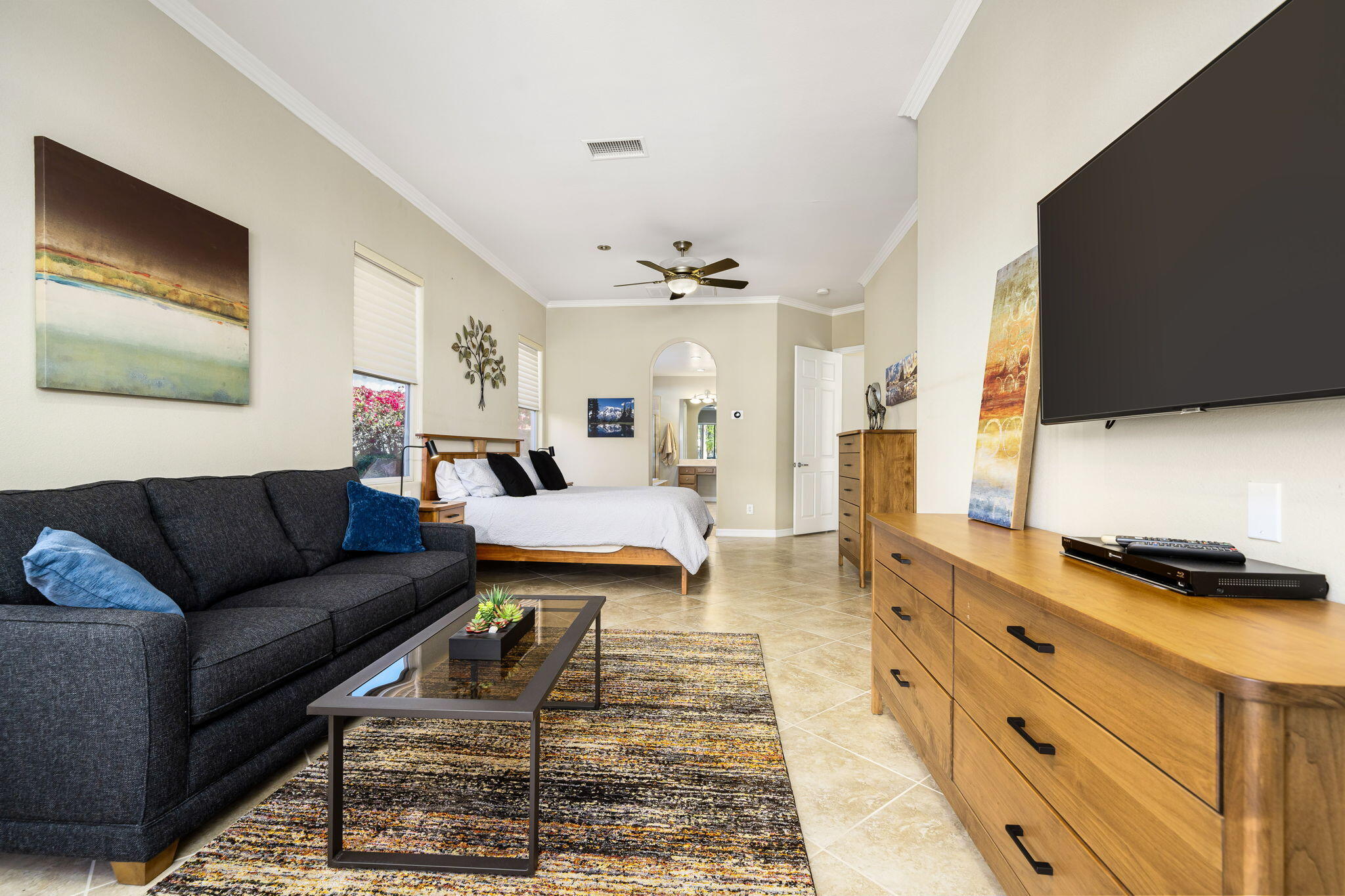 309 Loch Lomond Road Rancho Mirage, CA 92270 - Photo 11 of 27 a living room with furniture and a flat screen tv