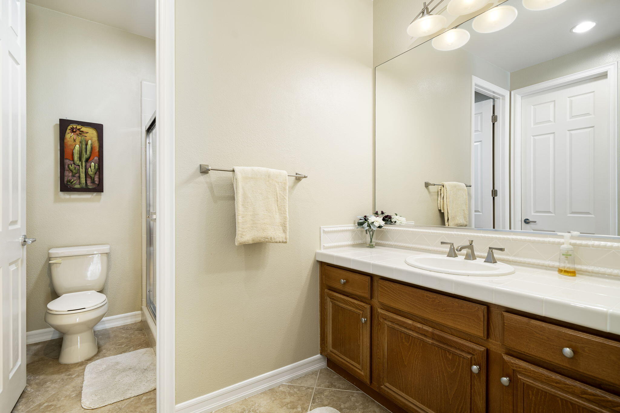 309 Loch Lomond Road Rancho Mirage, CA 92270 - Photo 14 of 27 a bathroom with a granite countertop sink toilet and shower