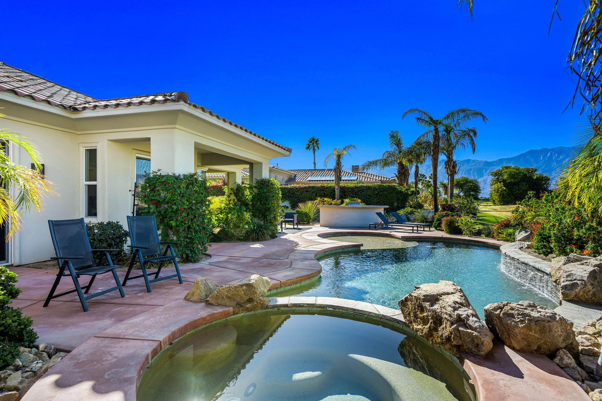 309 Loch Lomond Road Rancho Mirage, CA 92270 - Photo 17 of 27 a view of a swimming pool with a patio