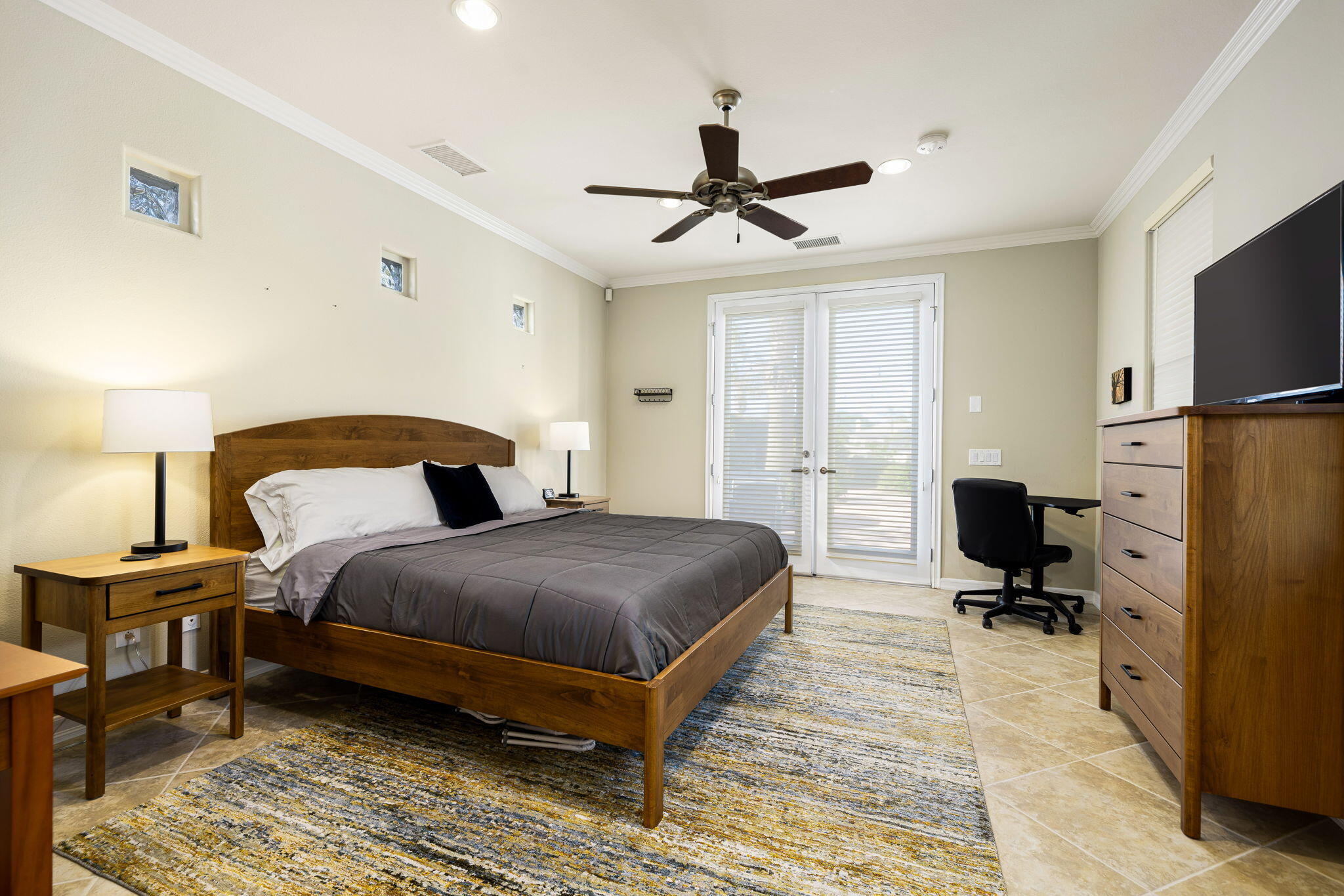 309 Loch Lomond Road Rancho Mirage, CA 92270 - Photo 22 of 27 a bedroom with a bed and a tv