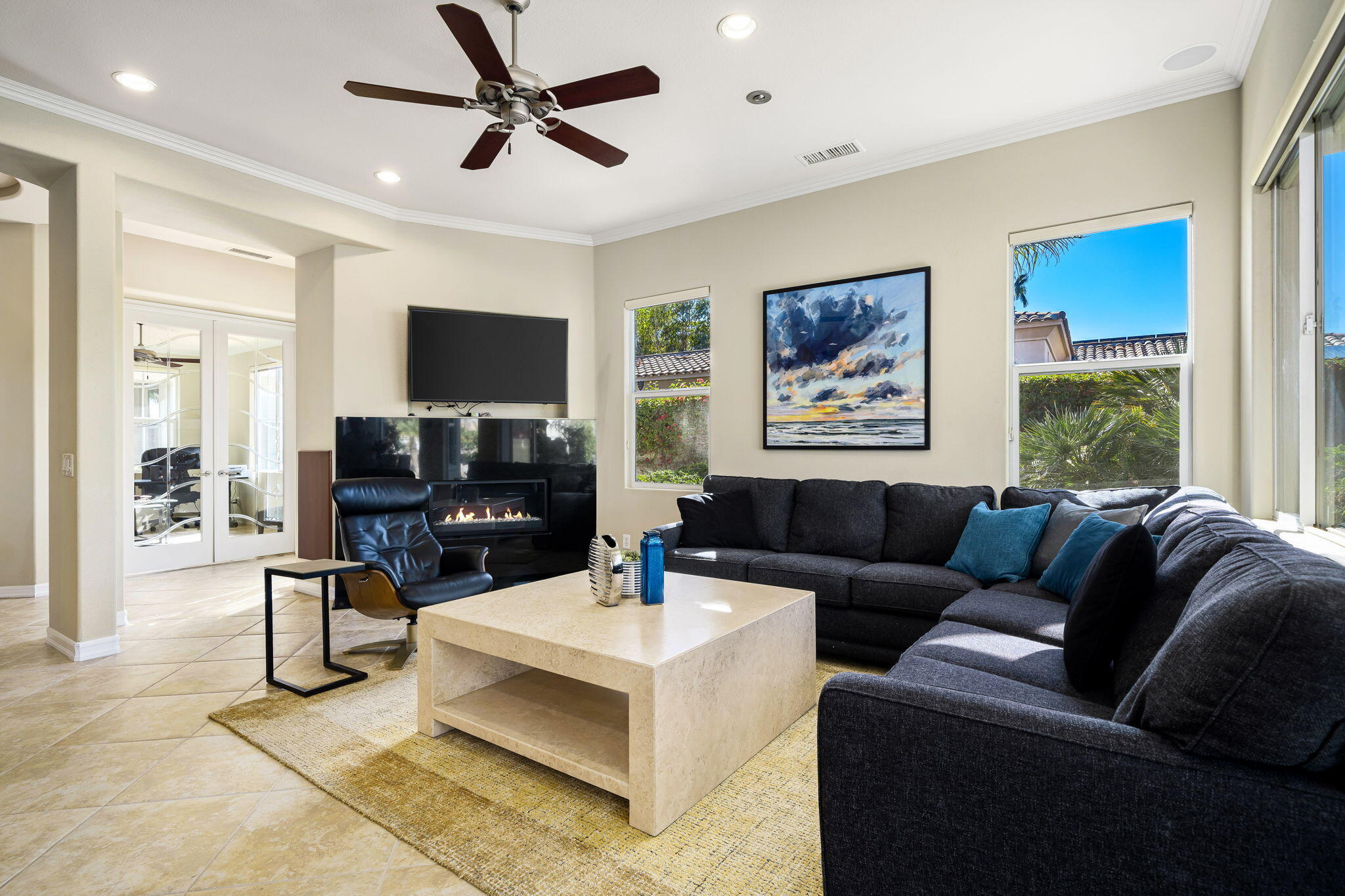 309 Loch Lomond Road Rancho Mirage, CA 92270 - Photo 7 of 27 a living room with furniture and a flat screen tv