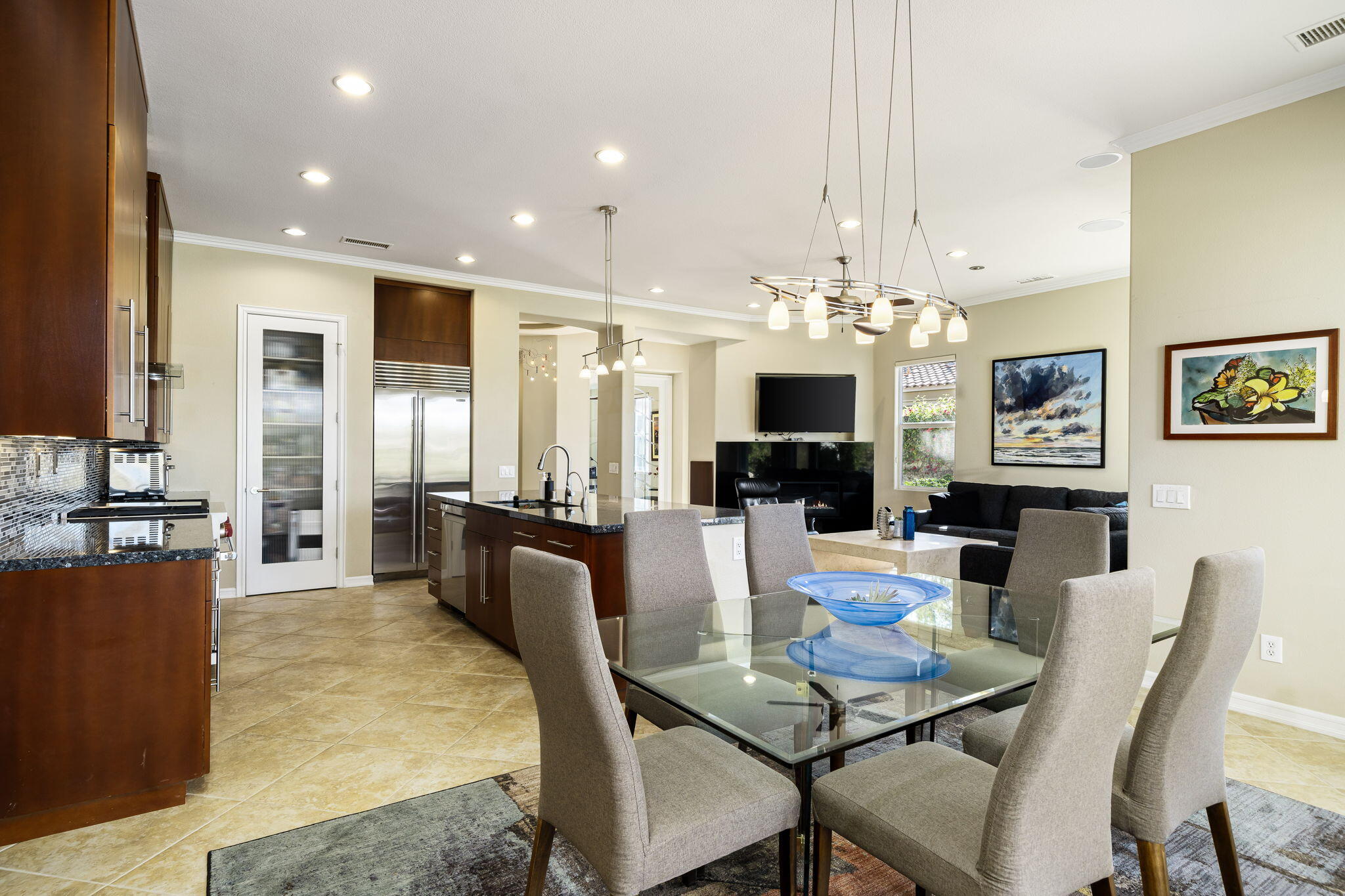 309 Loch Lomond Road Rancho Mirage, CA 92270 - Photo 8 of 27 a view of a dining room with furniture a chandelier and wooden floor