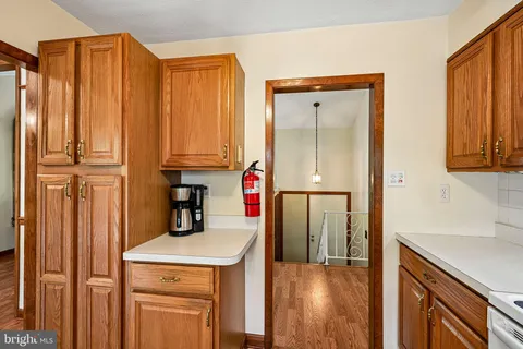a kitchen with a refrigerator and cabinets
