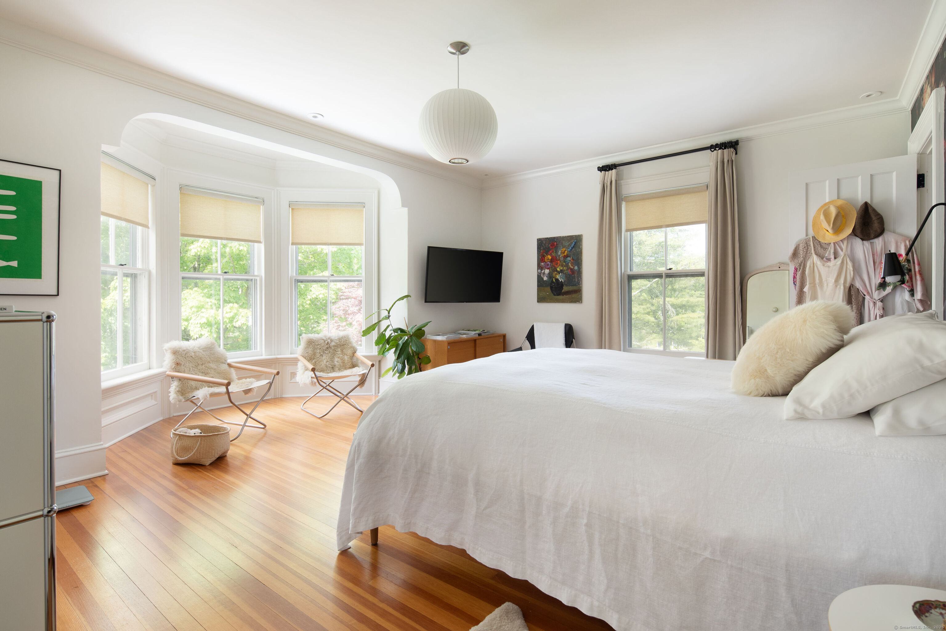 56 Sharon Road Salisbury, CT 06039 - Photo 26 of 39 a bedroom with a large bed and a large window