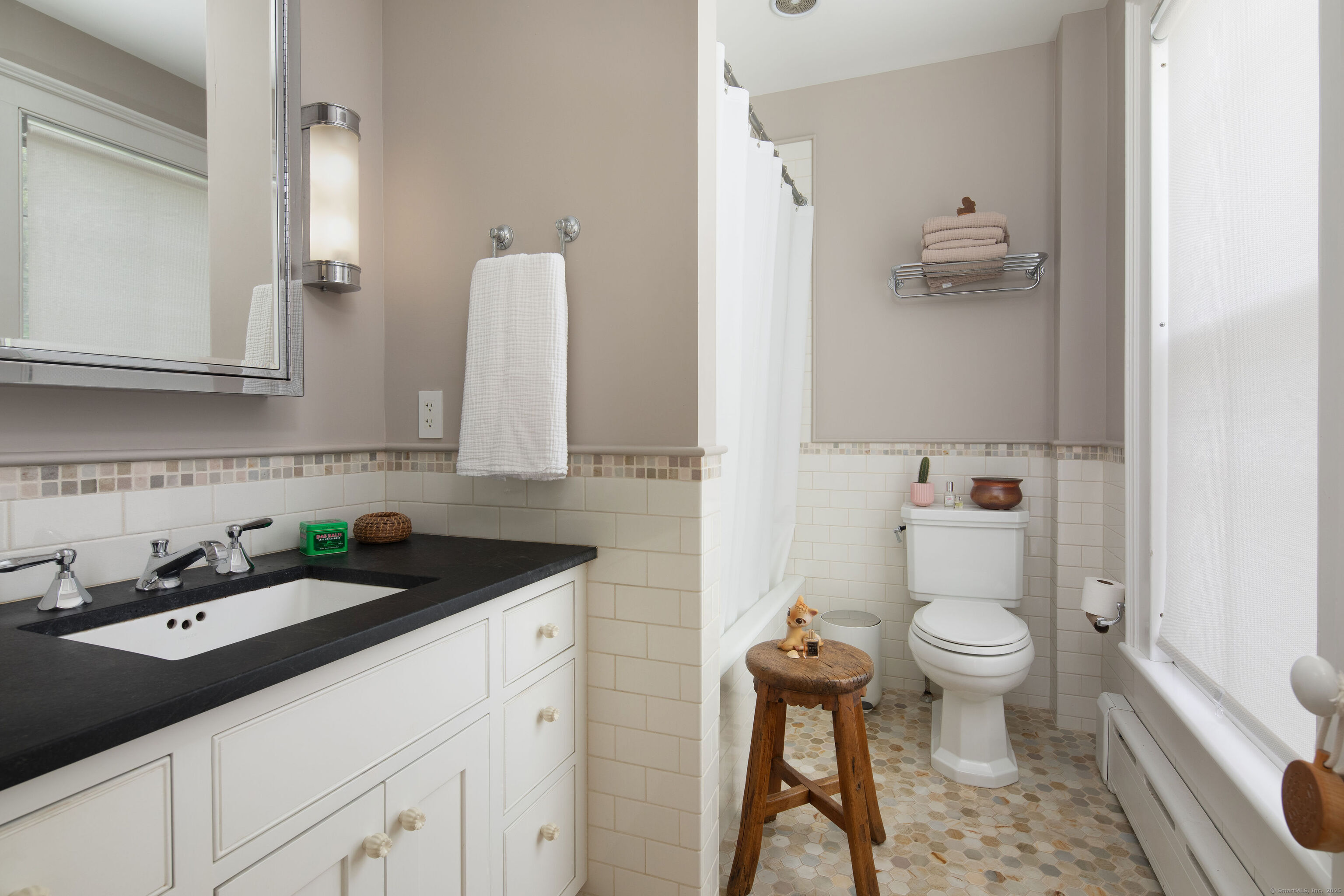 56 Sharon Road Salisbury, CT 06039 - Photo 28 of 39 a bathroom with a granite countertop sink a toilet and a mirror