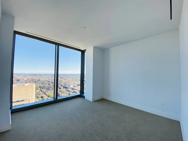 a view of an empty room and entryway