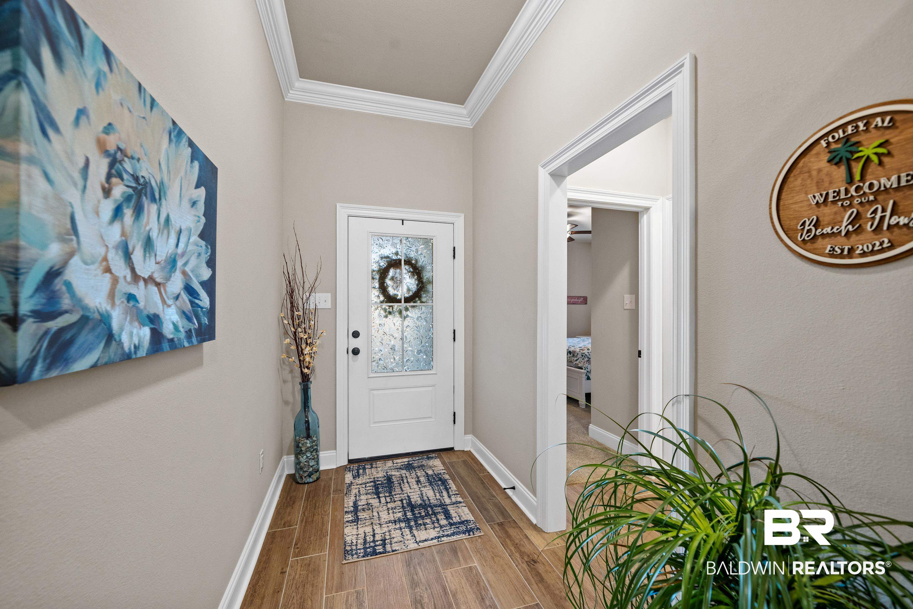 1390 Aldon Street Foley, AL 36535 - Photo 4 of 31 Foyer entrance featuring wood finish floors and ornamental molding