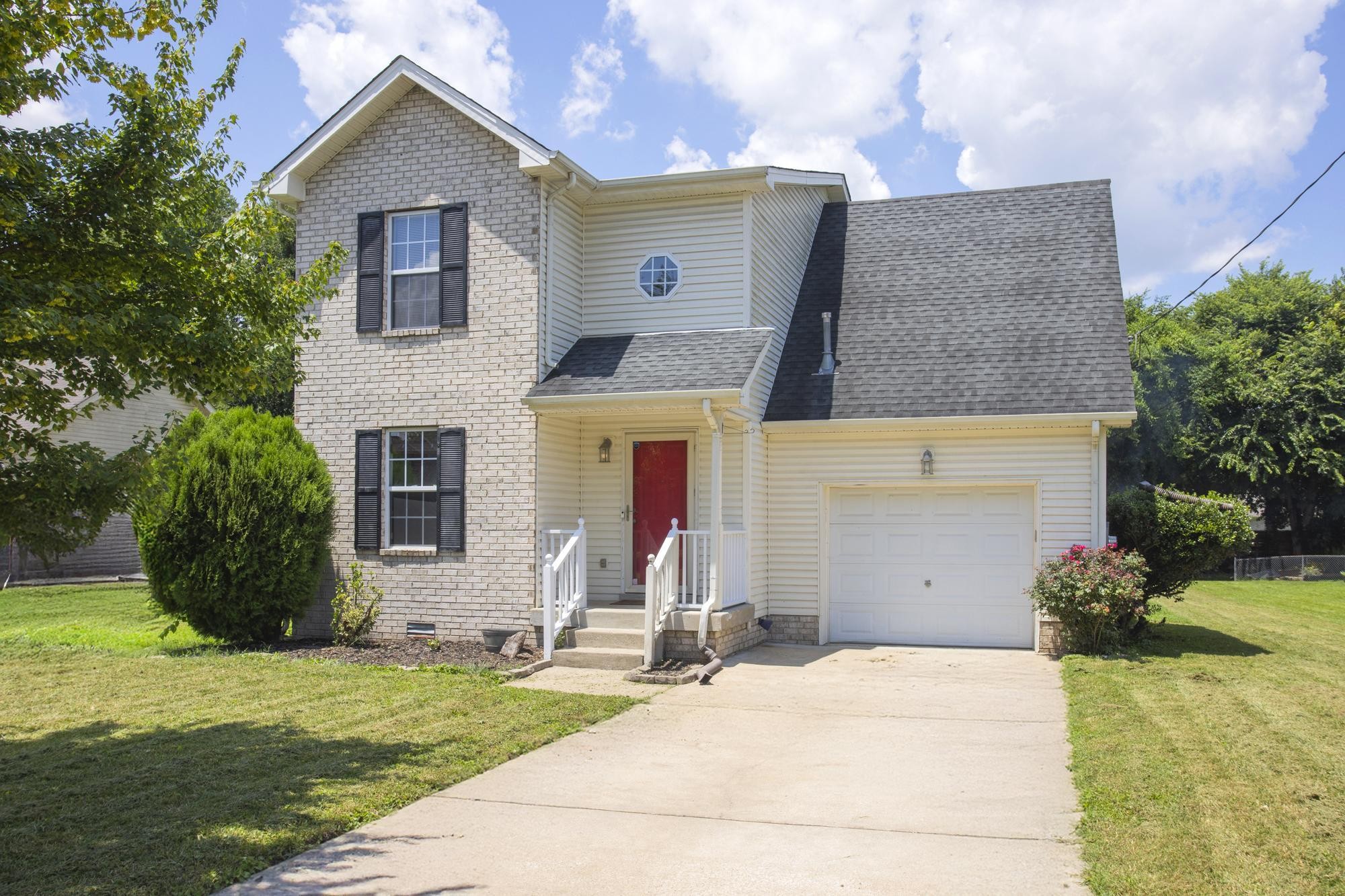 a front view of house with yard