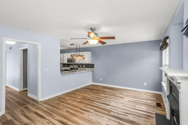 a bedroom with a bed and a potted plant