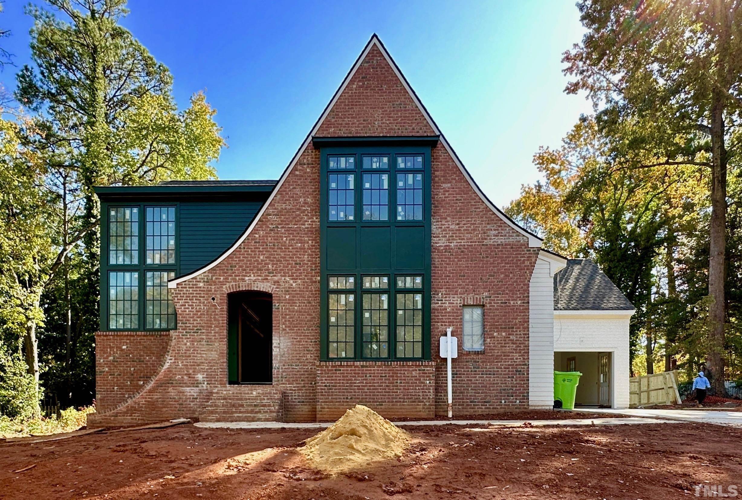 412 Ortega Road Raleigh, NC 27609 - Photo 2 of 53 a front view of a house with a yard and garage