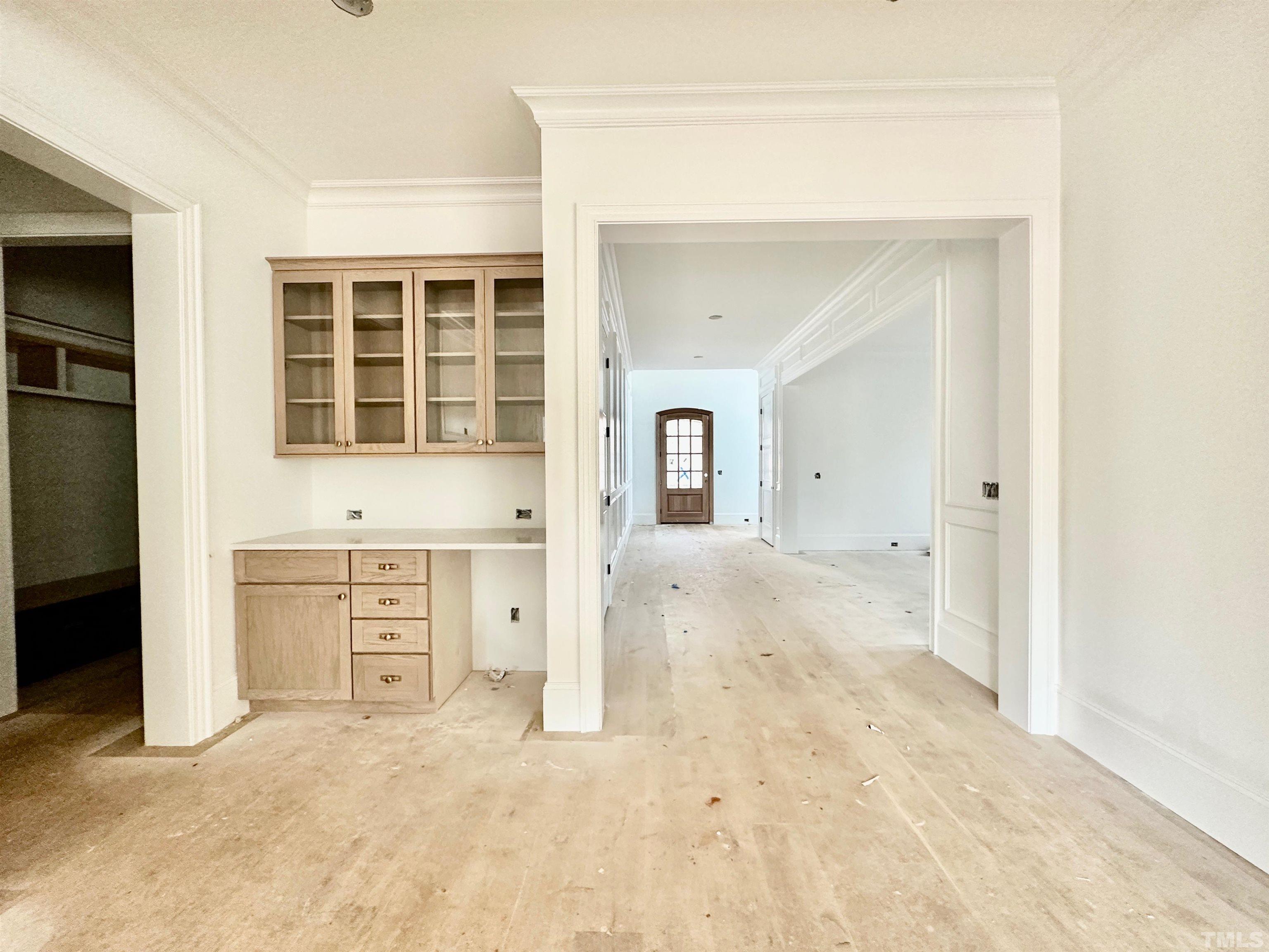 412 Ortega Road Raleigh, NC 27609 - Photo 23 of 53 an empty room with cabinet and mirrors