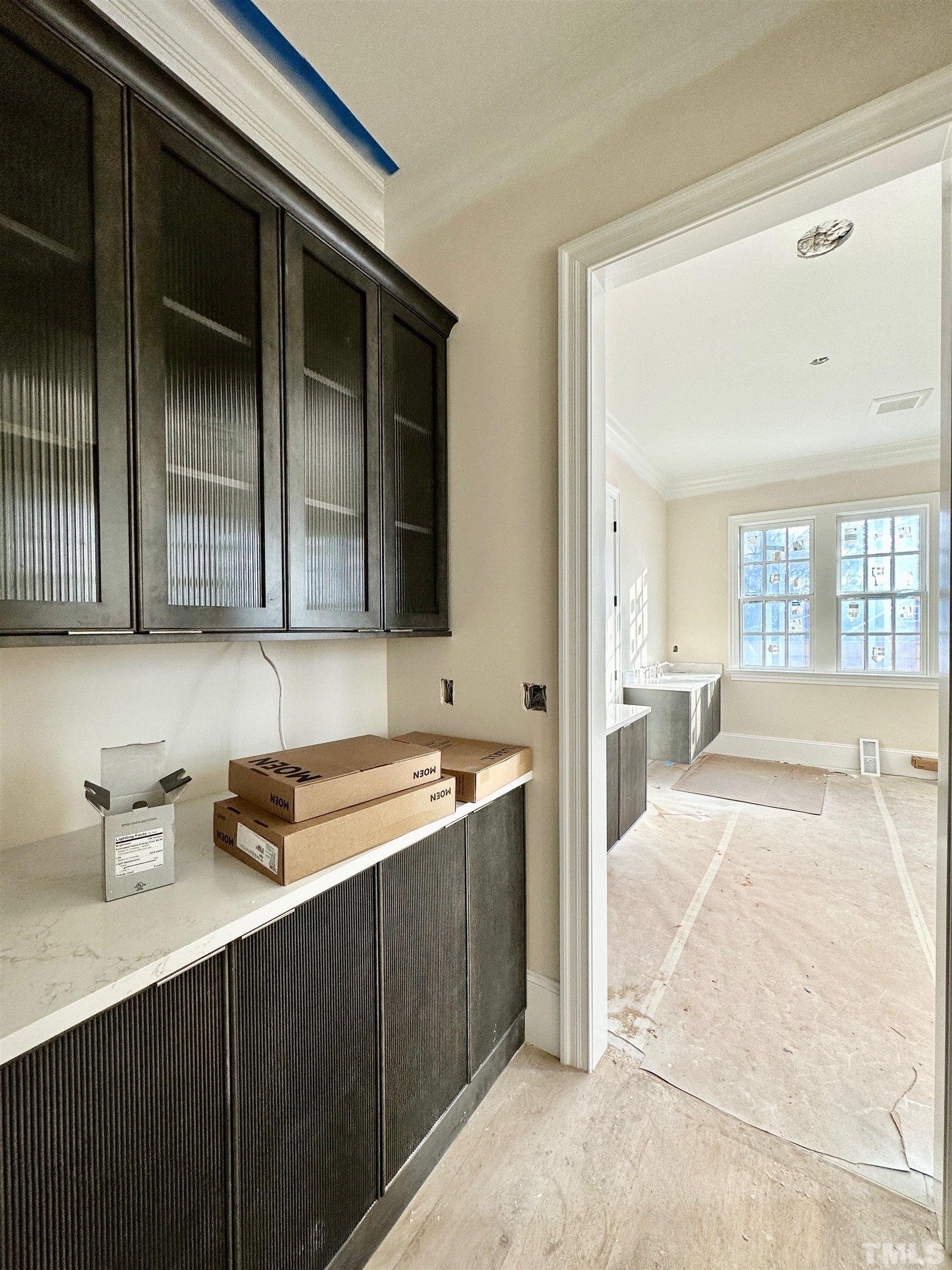 412 Ortega Road Raleigh, NC 27609 - Photo 31 of 53 a view of a kitchen with a sink and cabinets