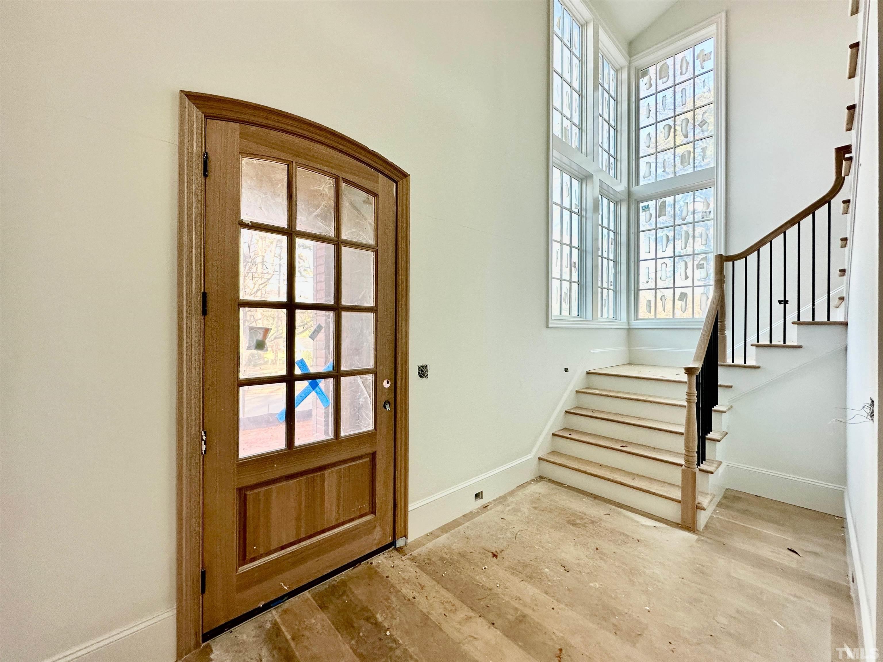 412 Ortega Road Raleigh, NC 27609 - Photo 4 of 53 a view of wooden floor and windows in a room