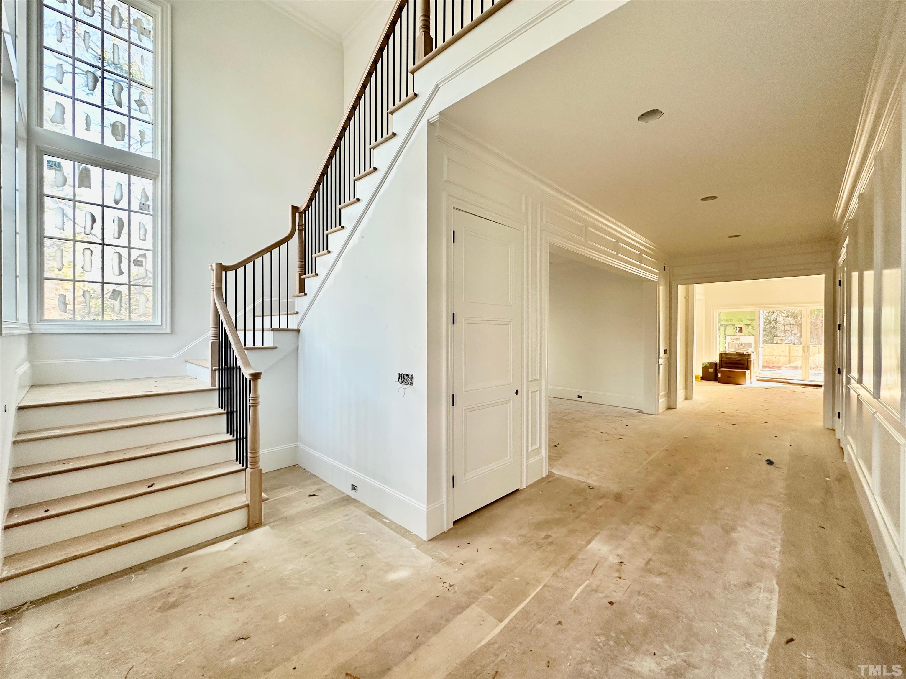 412 Ortega Road Raleigh, NC 27609 - Photo 5 of 53 a view of a hallway with wooden floor and entryway