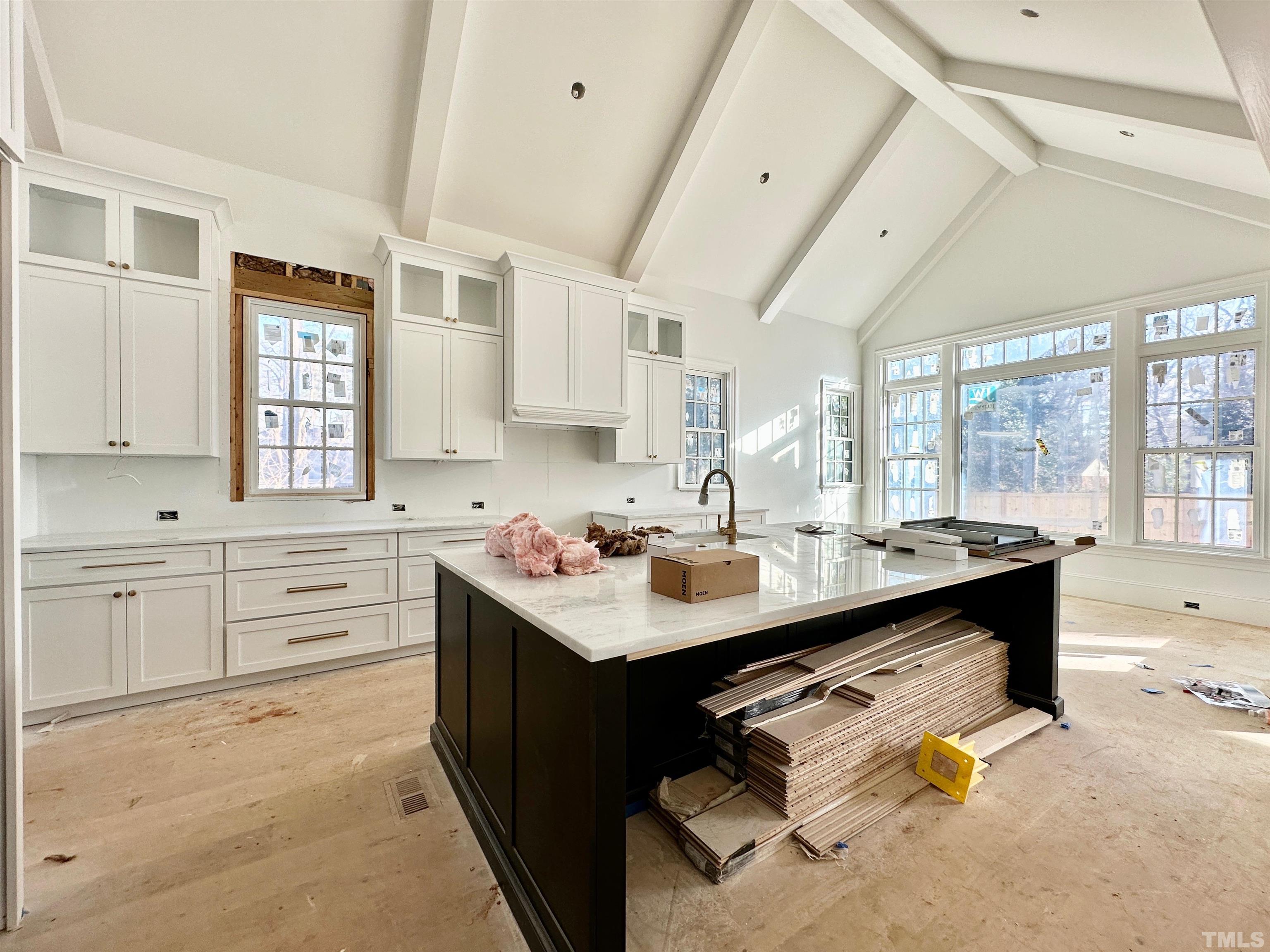 412 Ortega Road Raleigh, NC 27609 - Photo 8 of 53 a kitchen with sink stove and cabinets