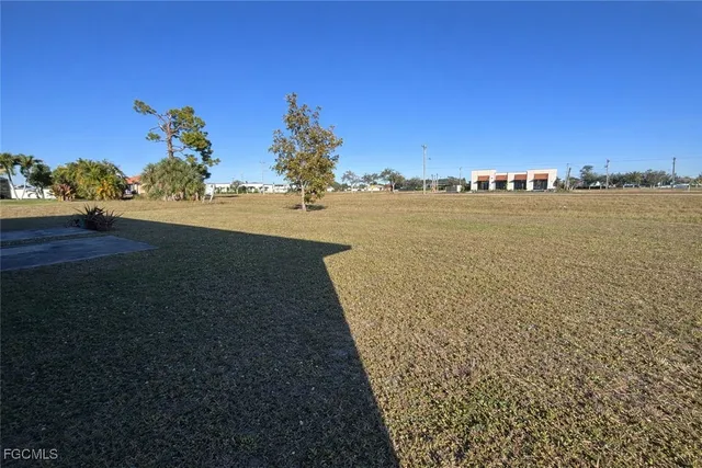 a view of a lake with a big yard