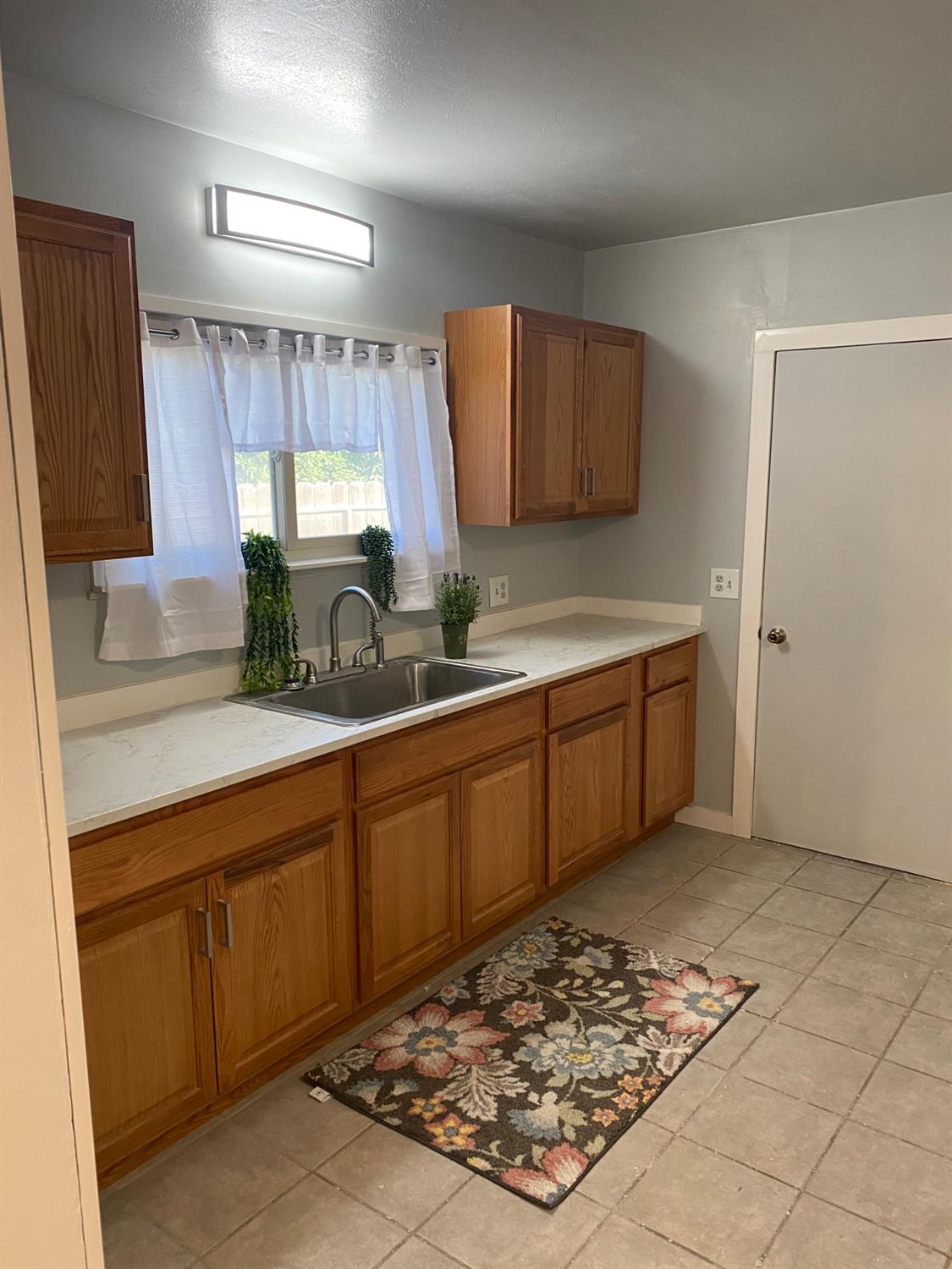947 West Friesen Avenue Reedley, CA 93654 - Photo 21 of 34 a kitchen with a sink cabinets and window