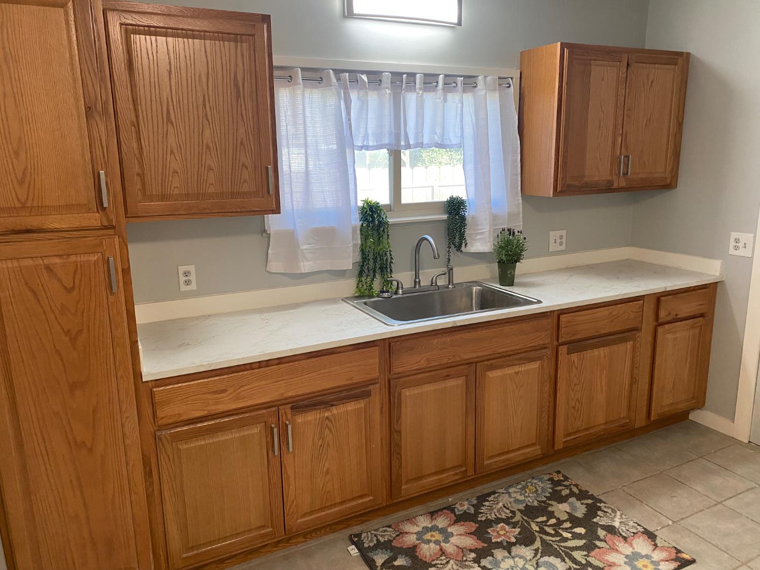 947 West Friesen Avenue Reedley, CA 93654 - Photo 3 of 34 a kitchen with sink and cabinets
