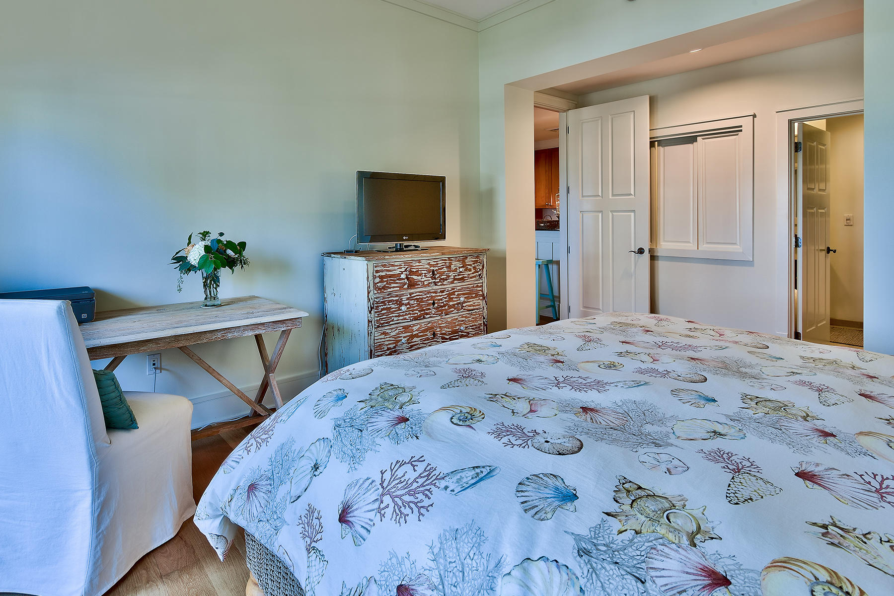 99 Compass Point Way, Unit 303 Watersound, FL 32461 - Photo 11 of 24 a bedroom with a bed and a flat screen tv