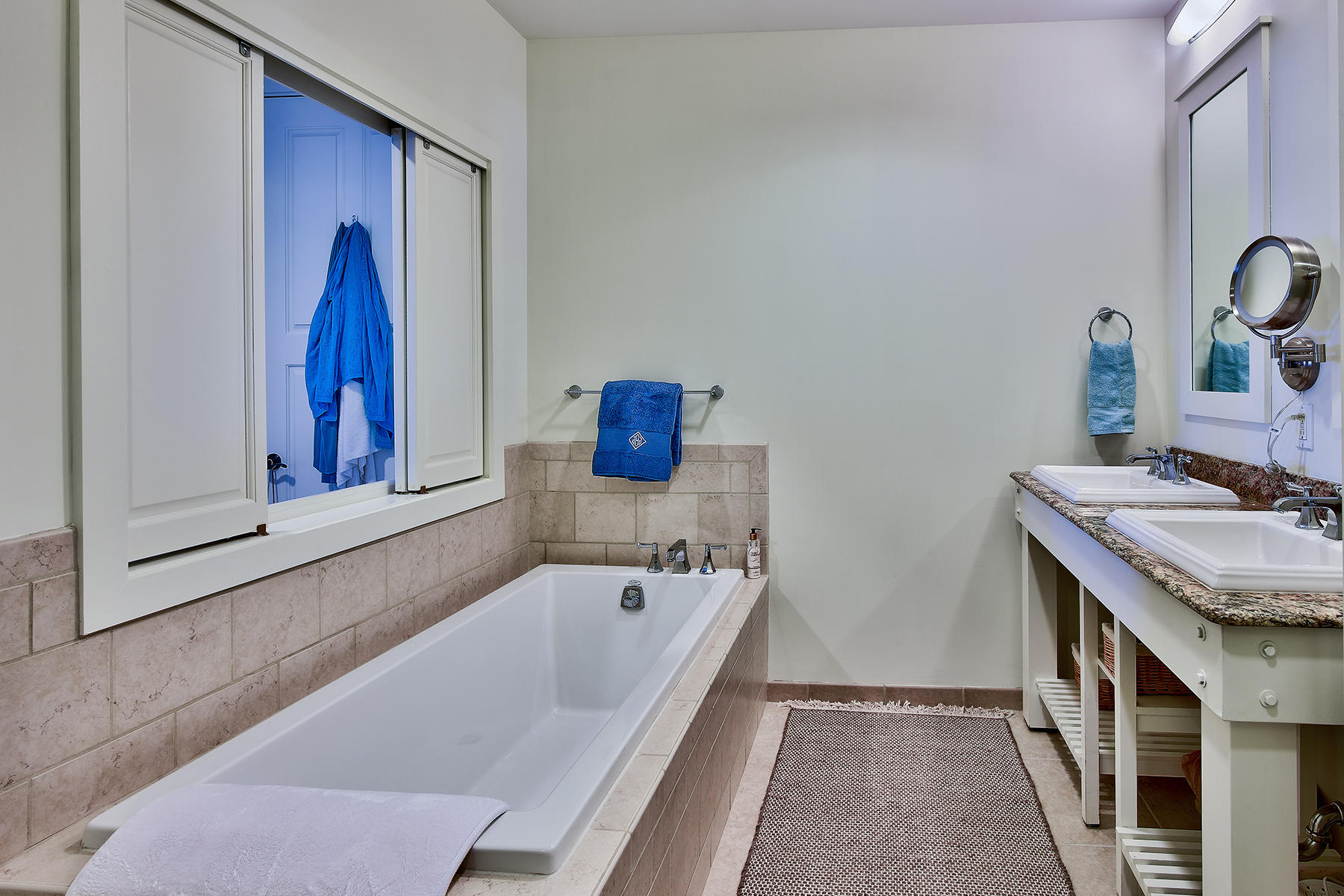 99 Compass Point Way, Unit 303 Watersound, FL 32461 - Photo 12 of 24 a bathroom with a bathtub and a sink