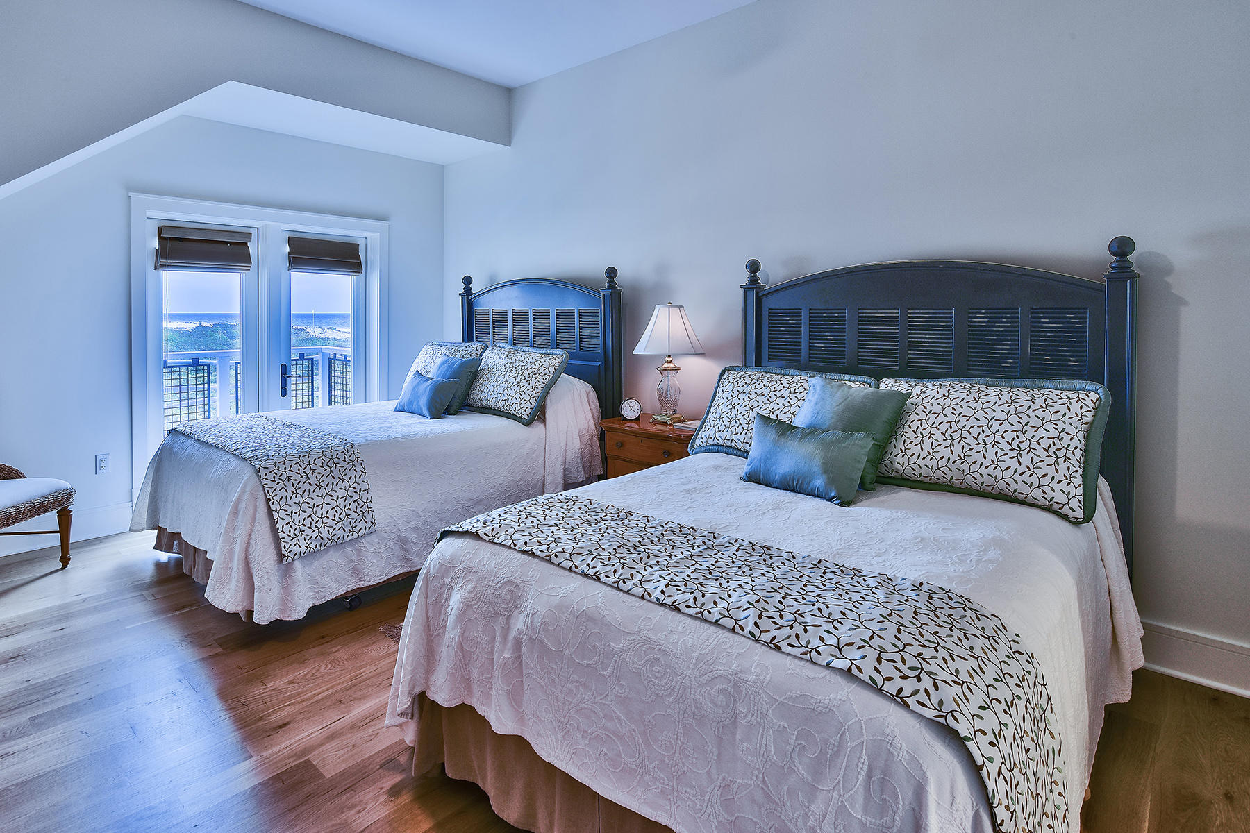 99 Compass Point Way, Unit 303 Watersound, FL 32461 - Photo 14 of 24 a bedroom with two beds and a dresser