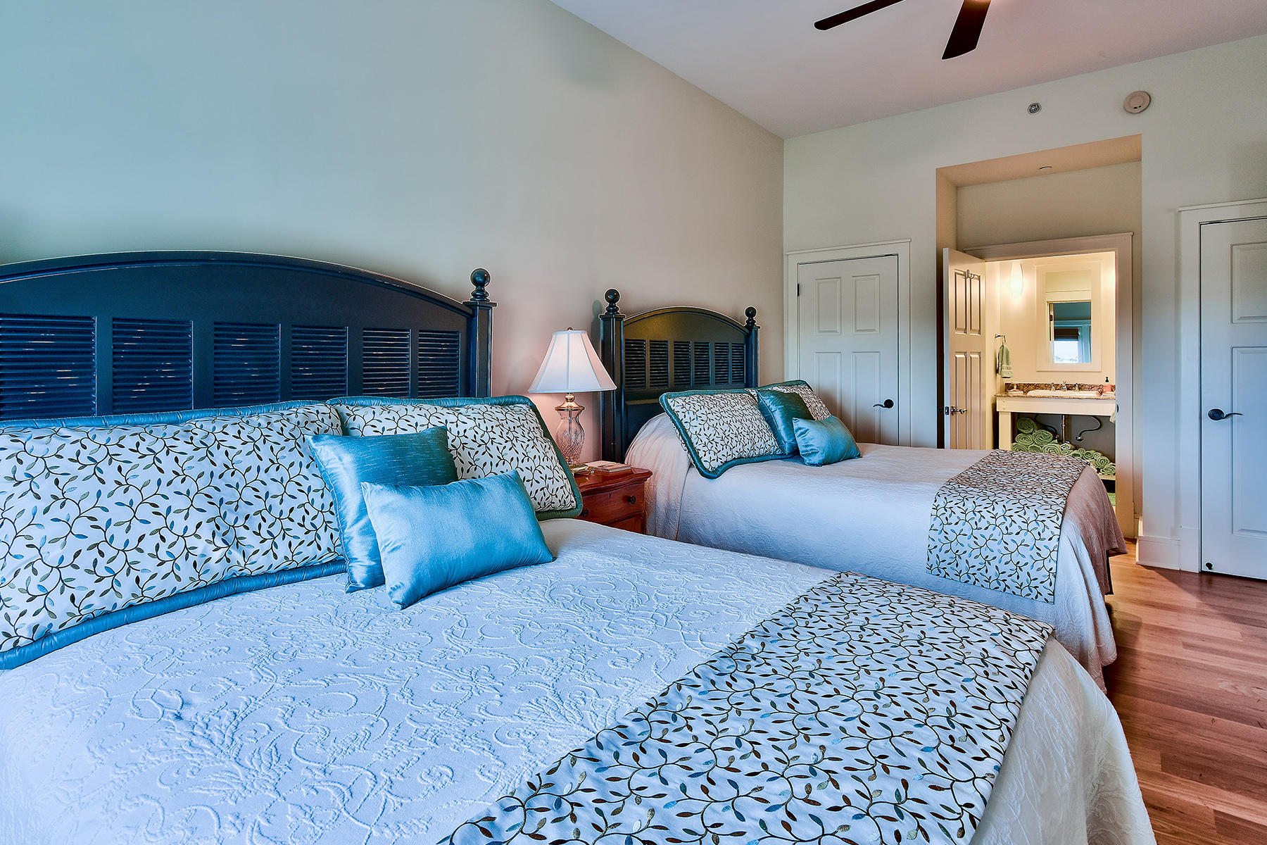 99 Compass Point Way, Unit 303 Watersound, FL 32461 - Photo 17 of 24 a bedroom with bed and wooden floor