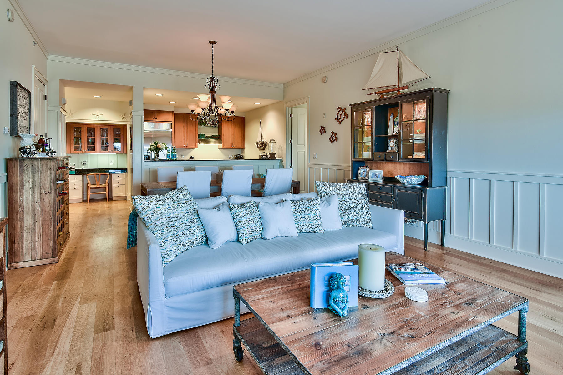99 Compass Point Way, Unit 303 Watersound, FL 32461 - Photo 3 of 24 a living room with furniture and a wooden floor