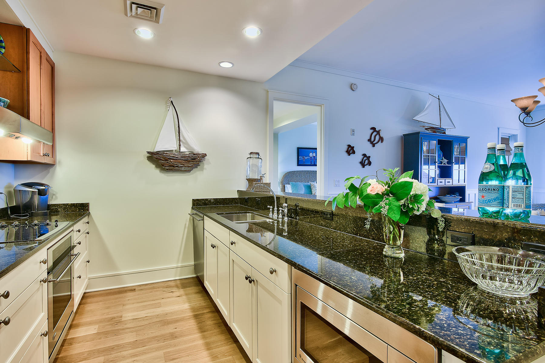 99 Compass Point Way, Unit 303 Watersound, FL 32461 - Photo 6 of 24 a kitchen with sink and cabinets