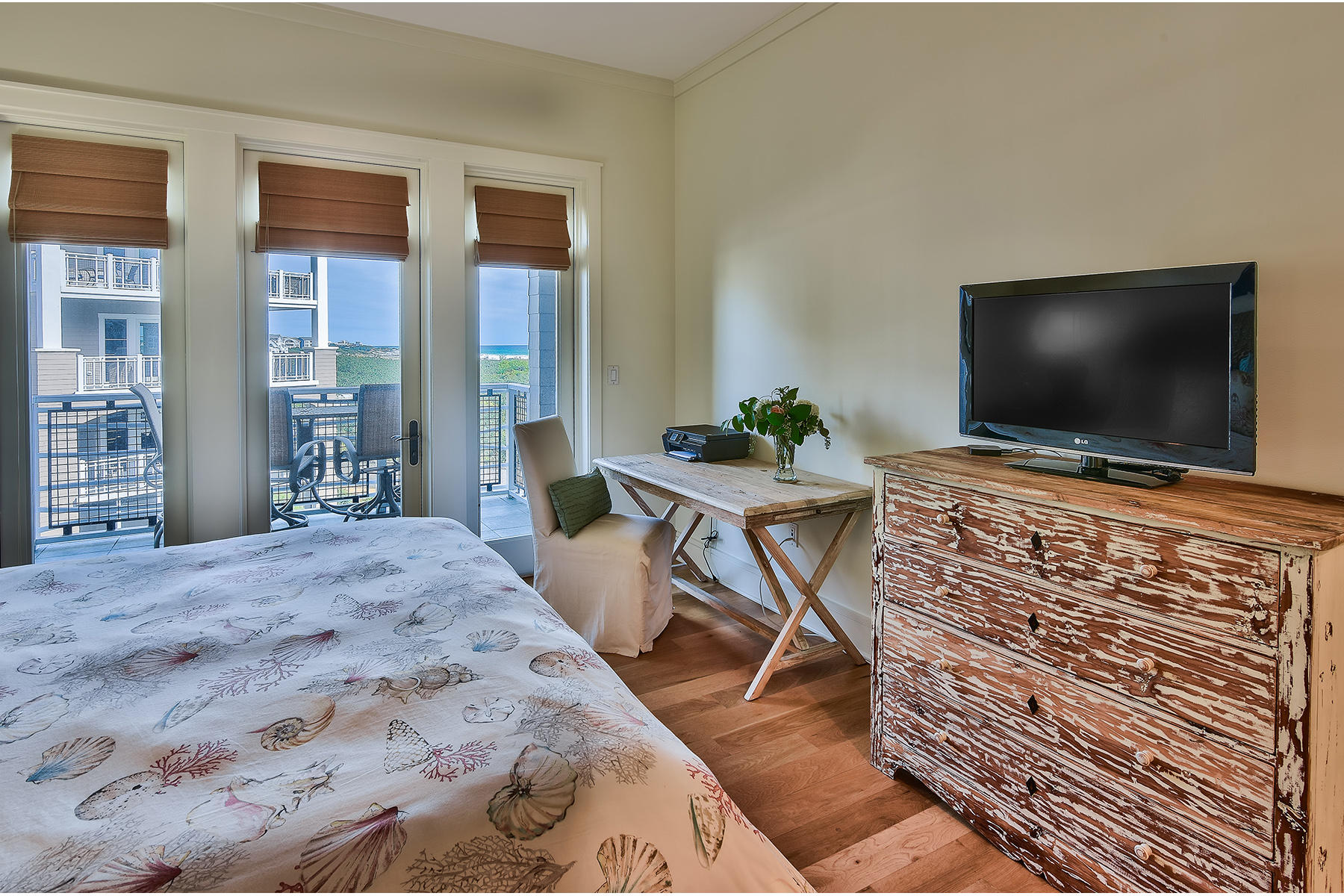 99 Compass Point Way, Unit 303 Watersound, FL 32461 - Photo 9 of 24 a living room with furniture and a flat screen tv