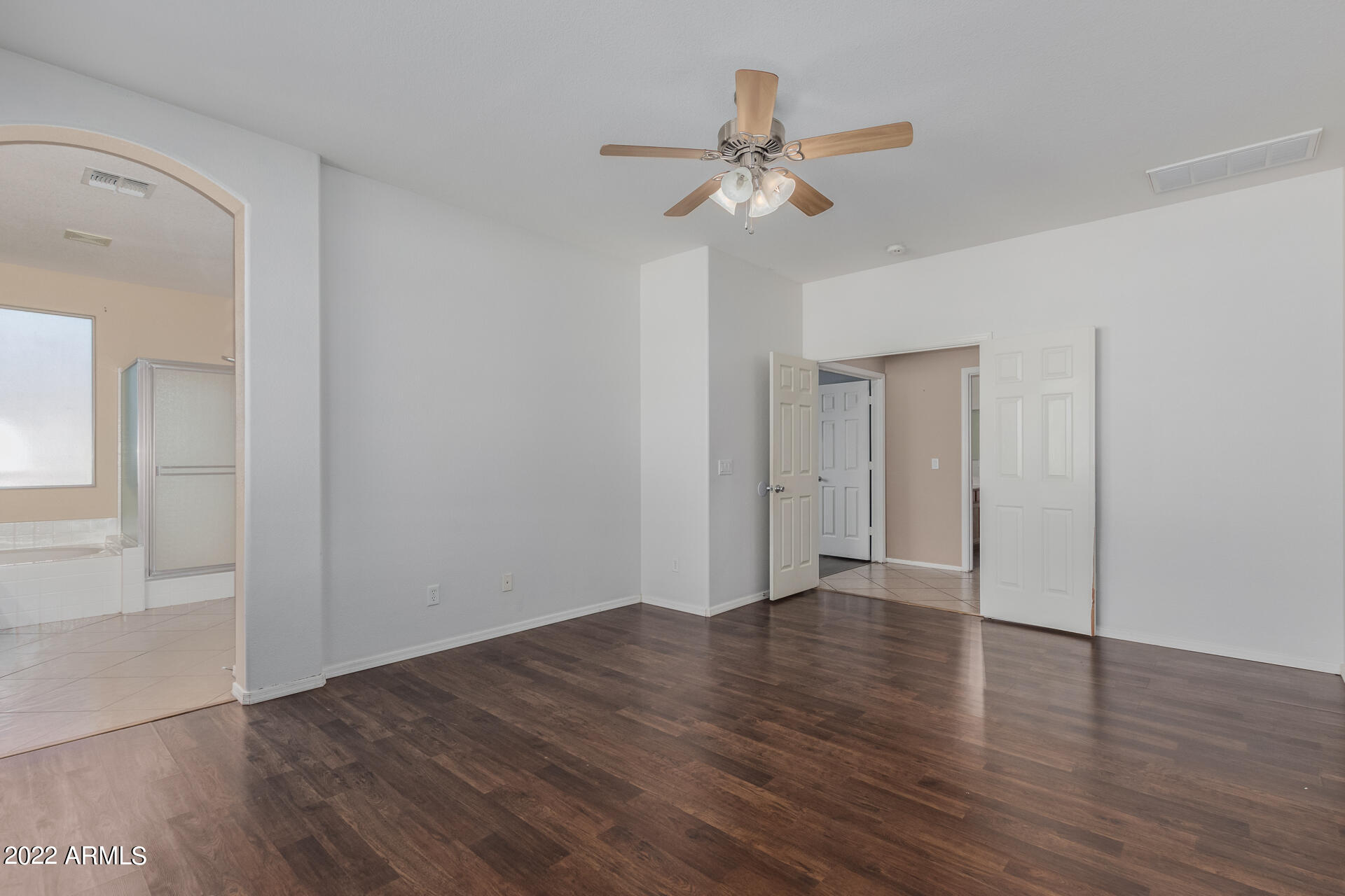 14440 West Redfield Road Surprise, AZ 85379 - Photo 15 of 36 a view of an empty room with wooden floor