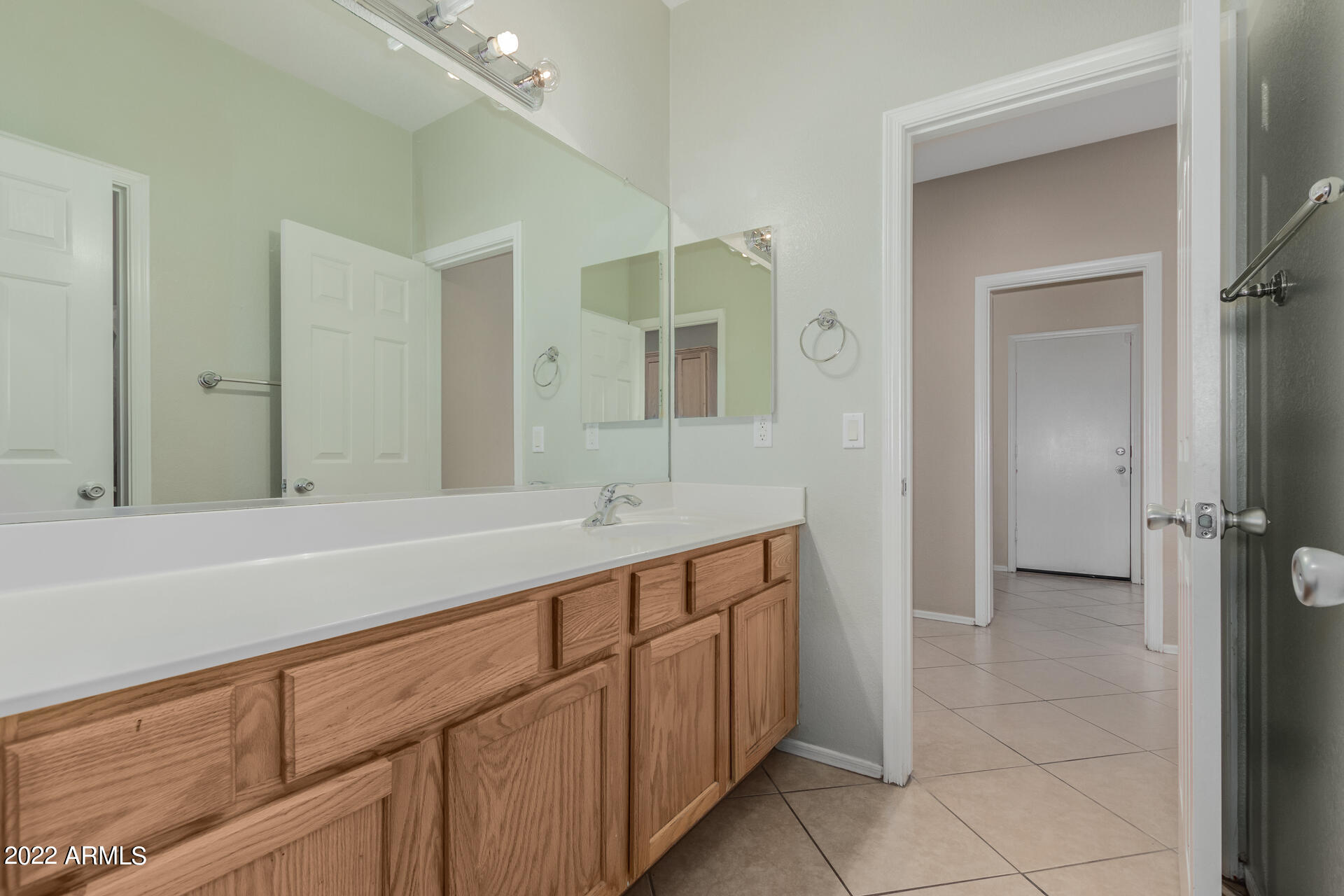 14440 West Redfield Road Surprise, AZ 85379 - Photo 16 of 36 a spacious bathroom with a sink and a mirror