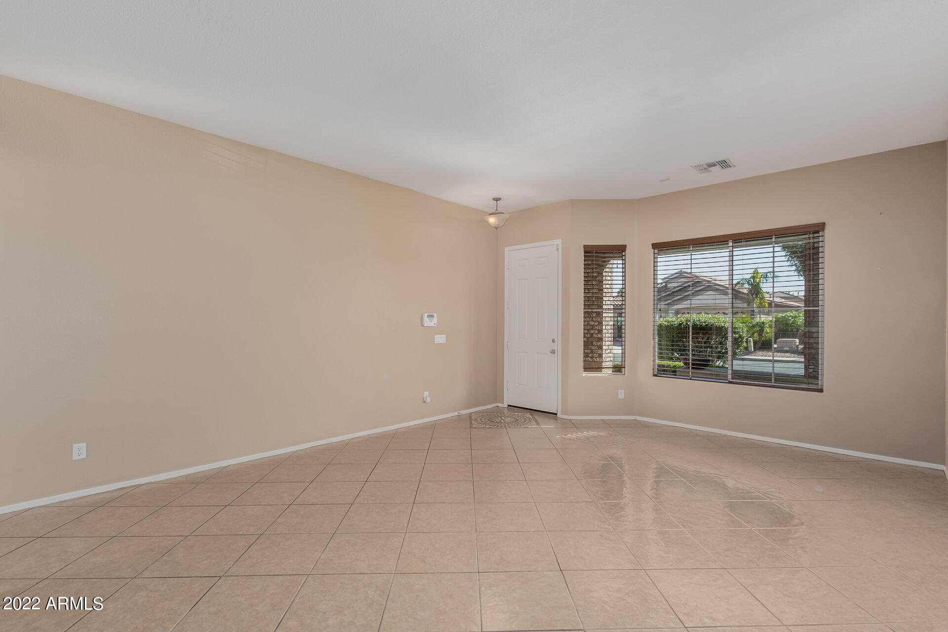 14440 West Redfield Road Surprise, AZ 85379 - Photo 22 of 36 a view of an empty room with a window