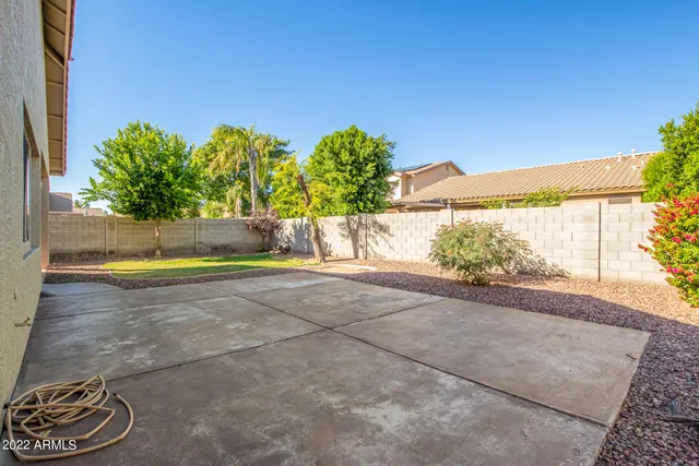 a view of a yard with potted plants