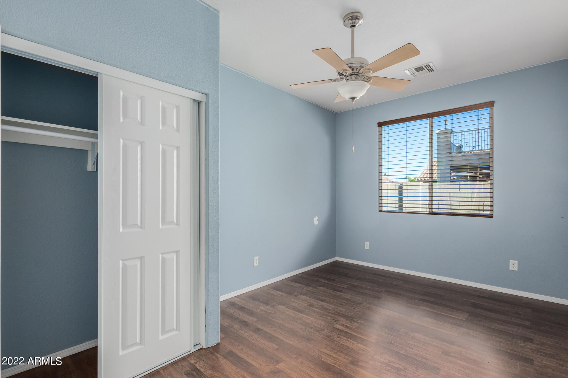 14440 West Redfield Road Surprise, AZ 85379 - Photo 32 of 36 wooden floor in an empty room with a window