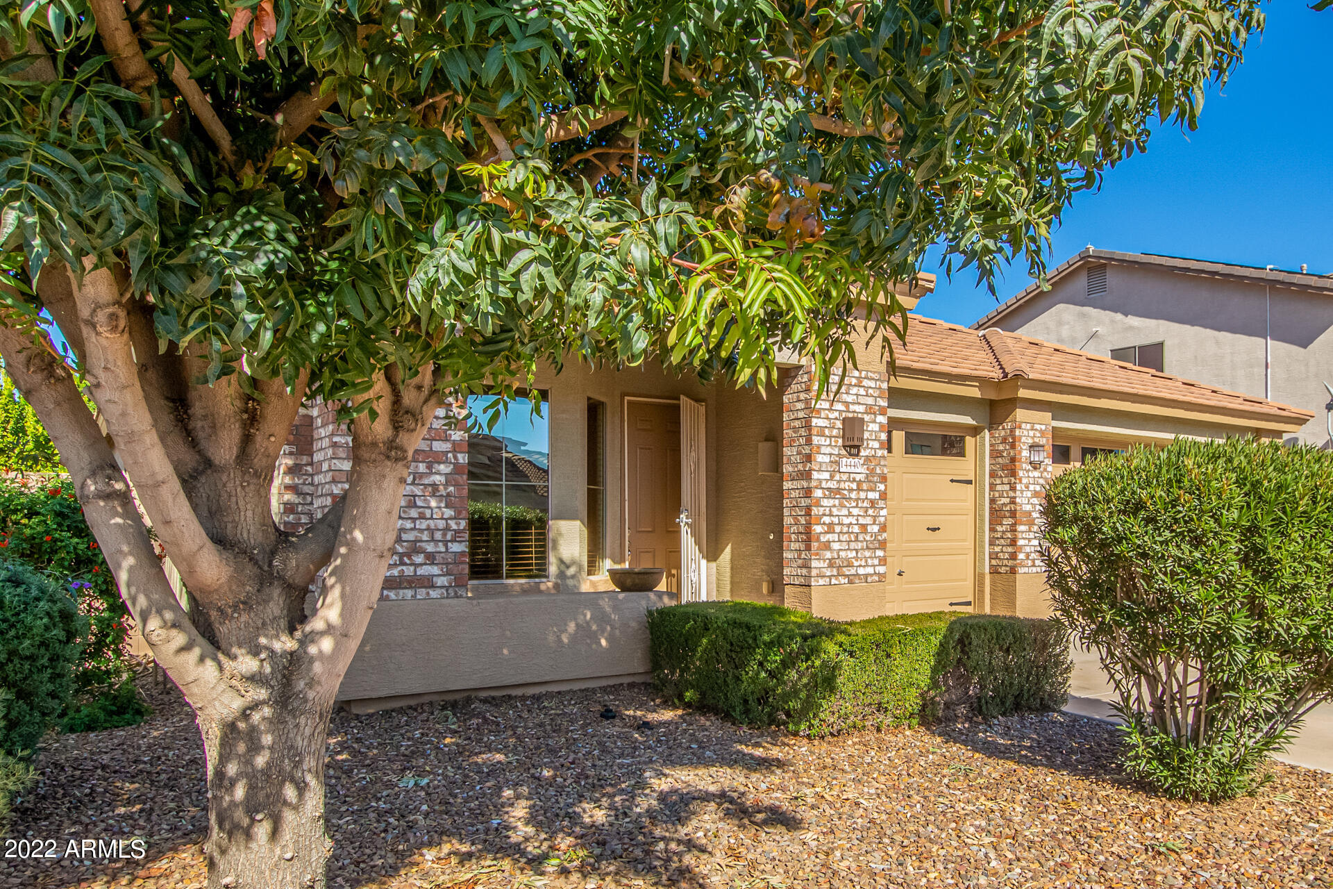 14440 West Redfield Road Surprise, AZ 85379 - Photo 36 of 36 a front view of a house with garden