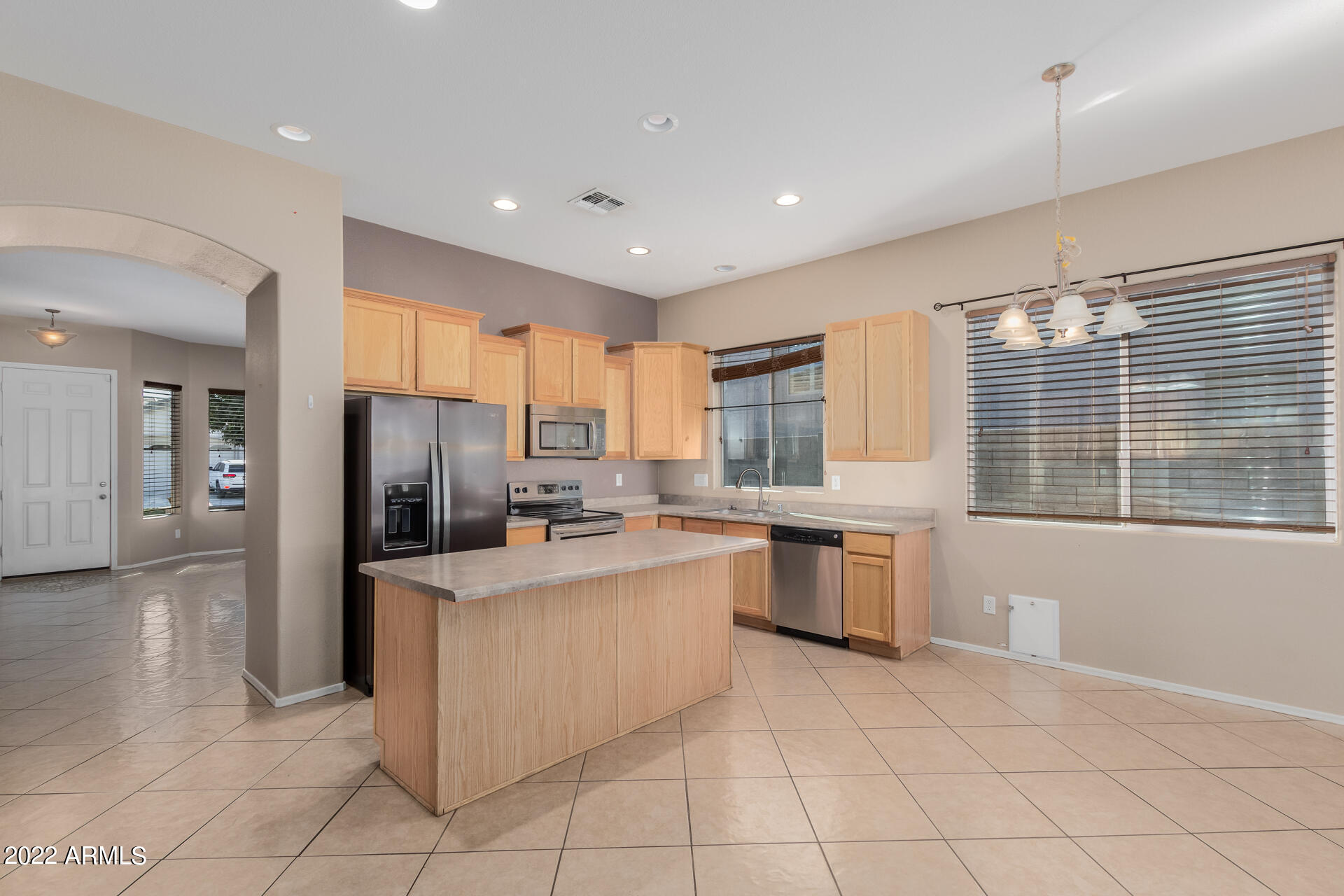 14440 West Redfield Road Surprise, AZ 85379 - Photo 7 of 36 a kitchen with a refrigerator and a sink