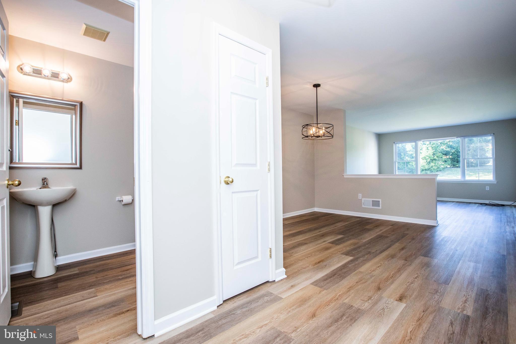 20 White Pine Gulch Reading, PA 19607 - Photo 3 of 28 Half bathroom and coat closet from entry