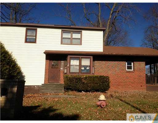 71 Pleasant Valley Road Old Bridge, NJ 08857 - Photo 2 of 4 a front view of a house with a yard