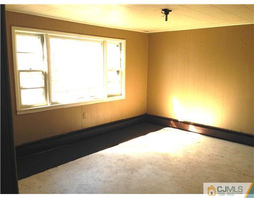 71 Pleasant Valley Road Old Bridge, NJ 08857 - Photo 3 of 4 a view of an empty room and window