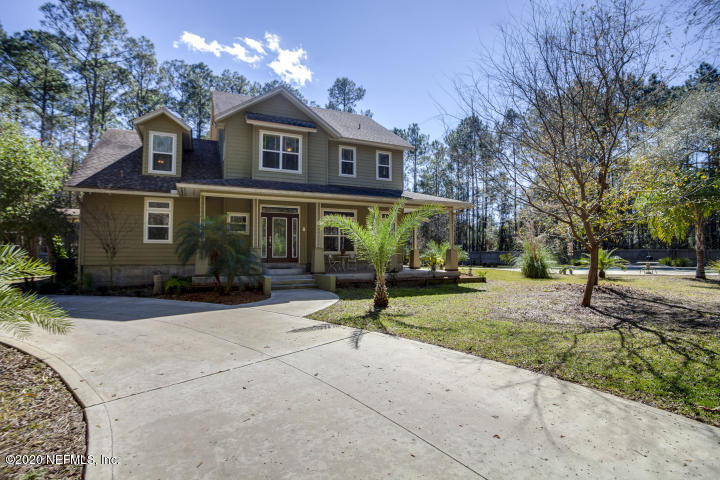 2349 Marlee Road South St. Johns, FL 32259 - Photo 2 of 3 a view of a house with a yard and large tree