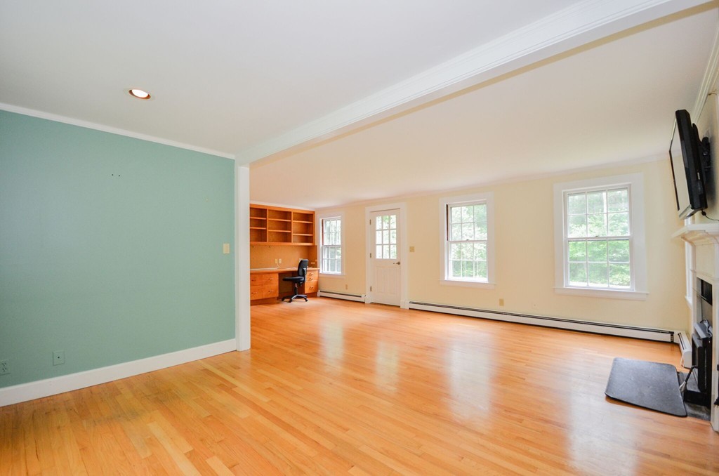 544 Point Road Marion, MA 02738 - Photo 12 of 25 a view of an empty room with a window and wooden floor