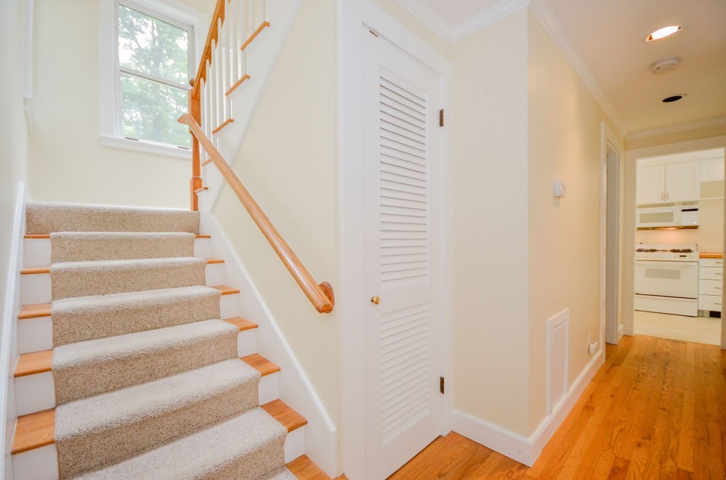 544 Point Road Marion, MA 02738 - Photo 14 of 25 a view of staircase with white walls and wooden floor