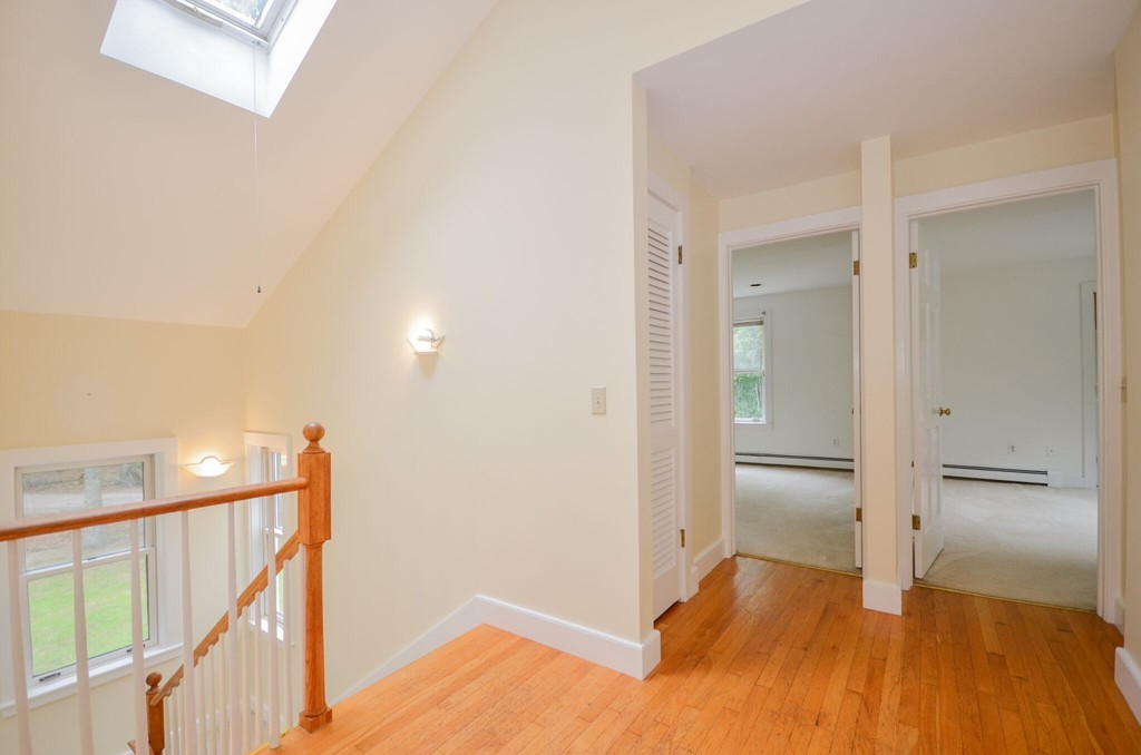 544 Point Road Marion, MA 02738 - Photo 15 of 25 a view of empty room with wooden floor and stairs