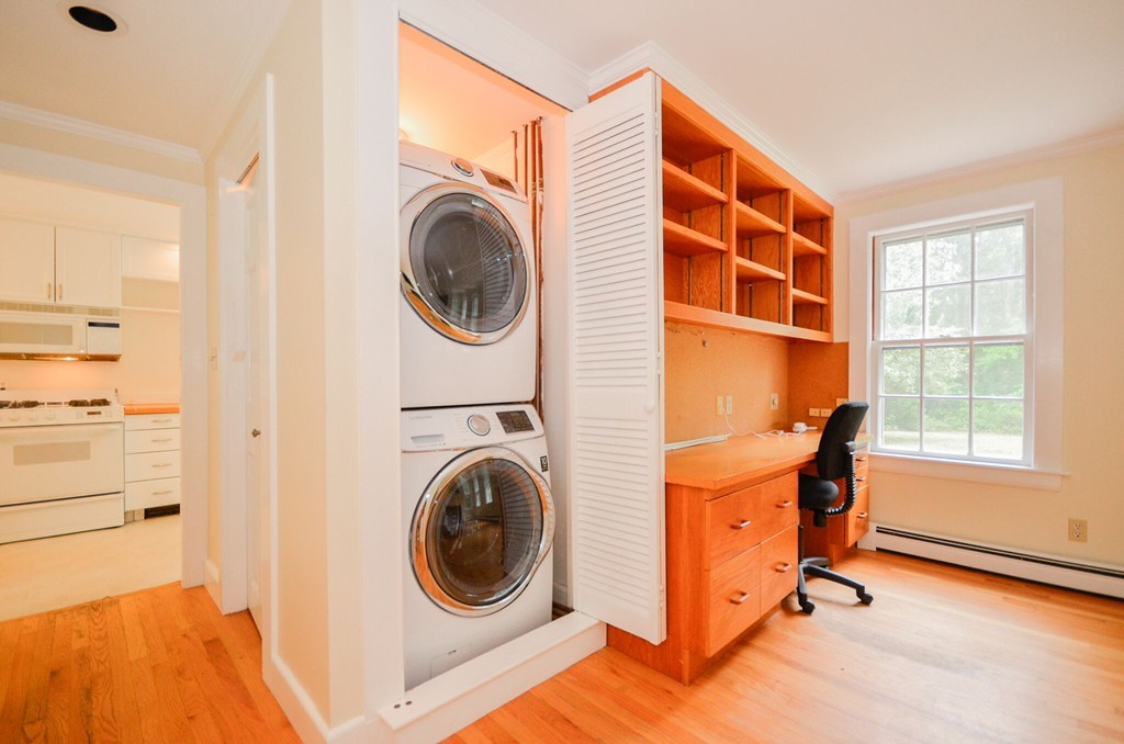 544 Point Road Marion, MA 02738 - Photo 10 of 25 a view of a bedroom with washer and dryer