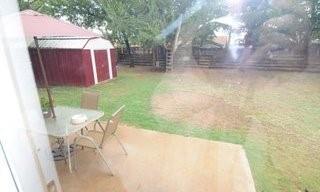 2636 Rountree Drive Abilene, TX 79601 - Photo 12 of 14 Fenced backyard featuring a storage unit, outdoor dining space, and a patio area