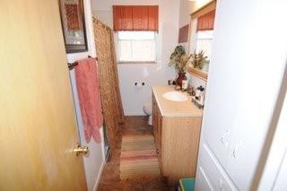 2636 Rountree Drive Abilene, TX 79601 - Photo 4 of 14 Bathroom with vanity and a shower/tub with curtain